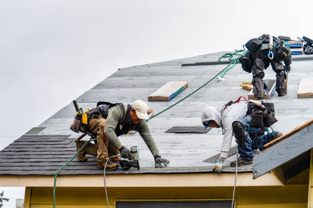 Professional Storm Damage Roof Repair technician working in Tulare, CA